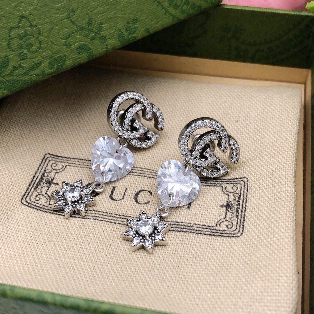 Martin Graham stud earrings in polished metal-tone – side detail