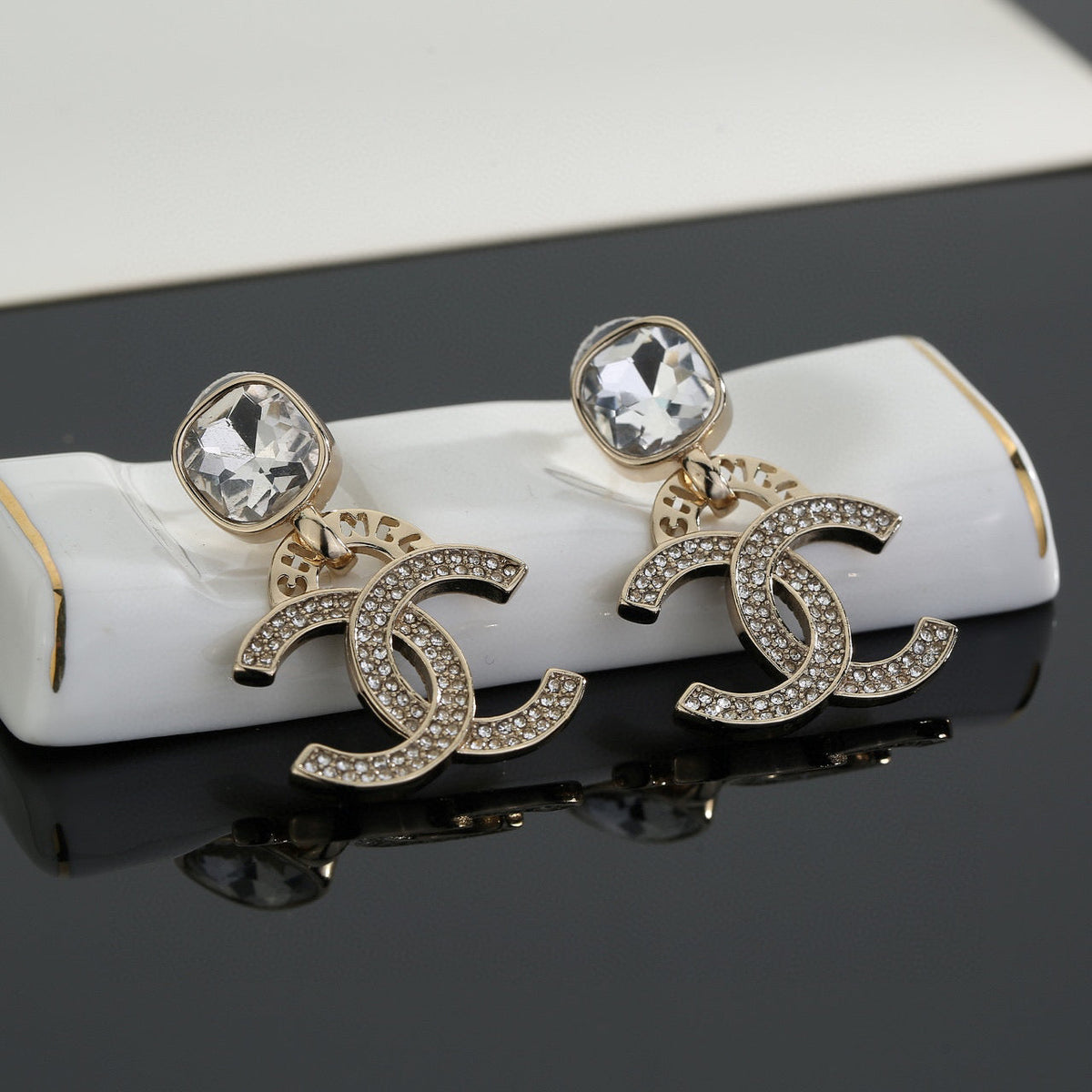 Martin Graham stud earrings in polished metal-tone – side detail