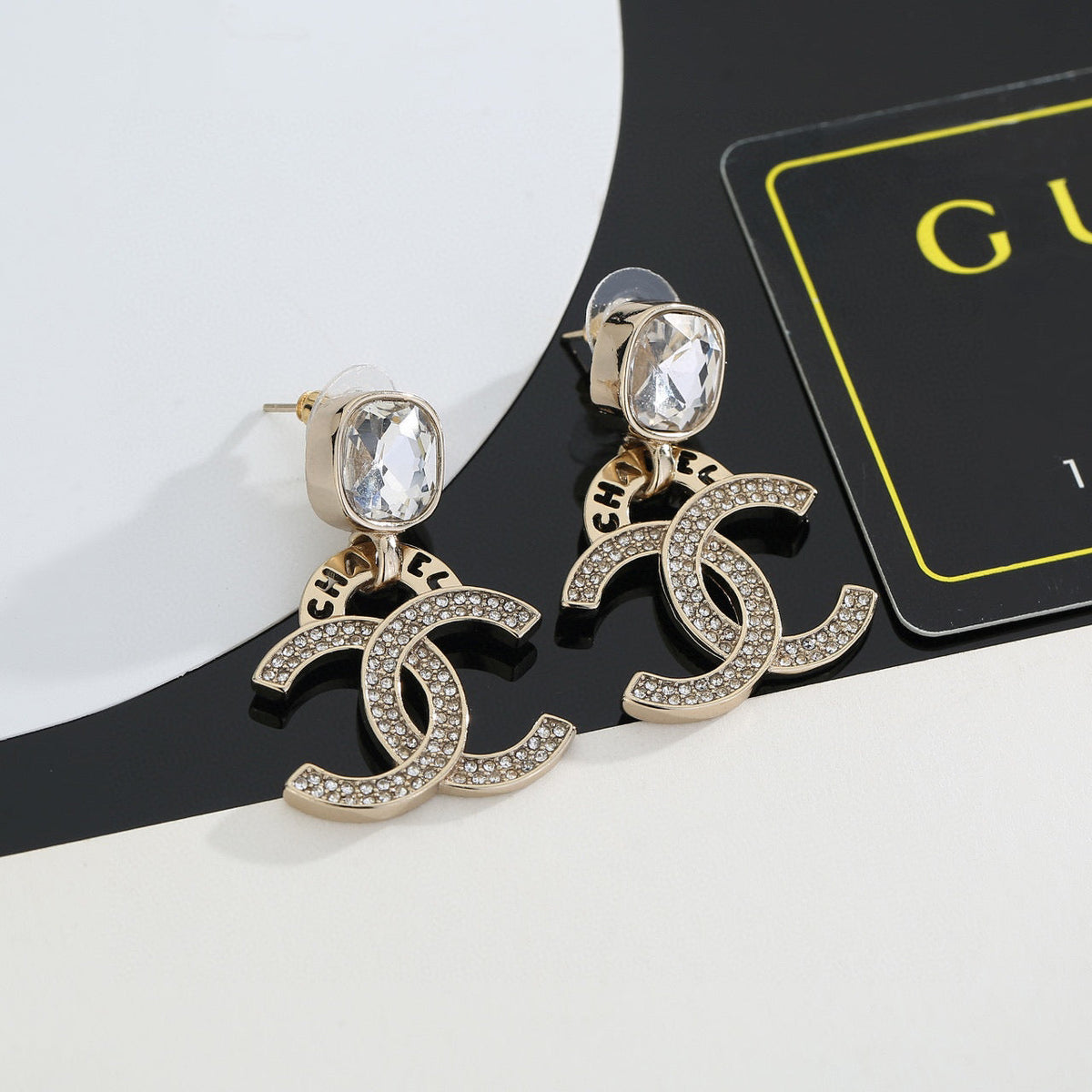 Martin Graham stud earrings in polished metal-tone – detail view