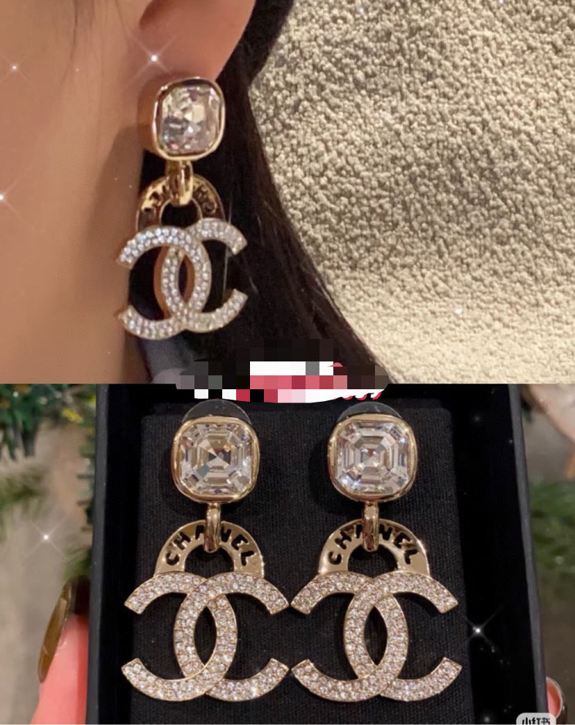 Martin Graham stud earrings in polished metal-tone – front product view