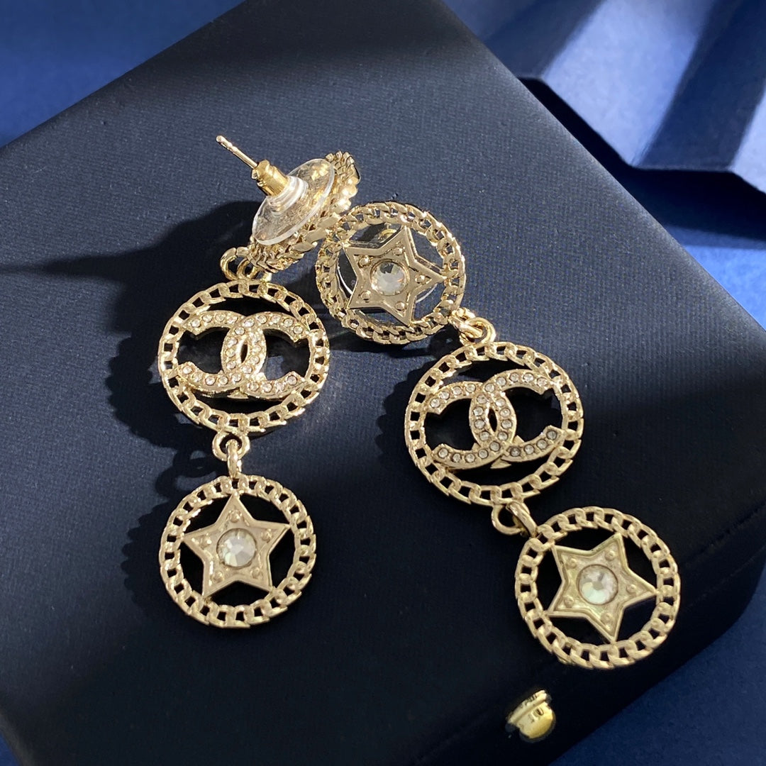 Martin Graham stud earrings in polished metal-tone – close-up detail