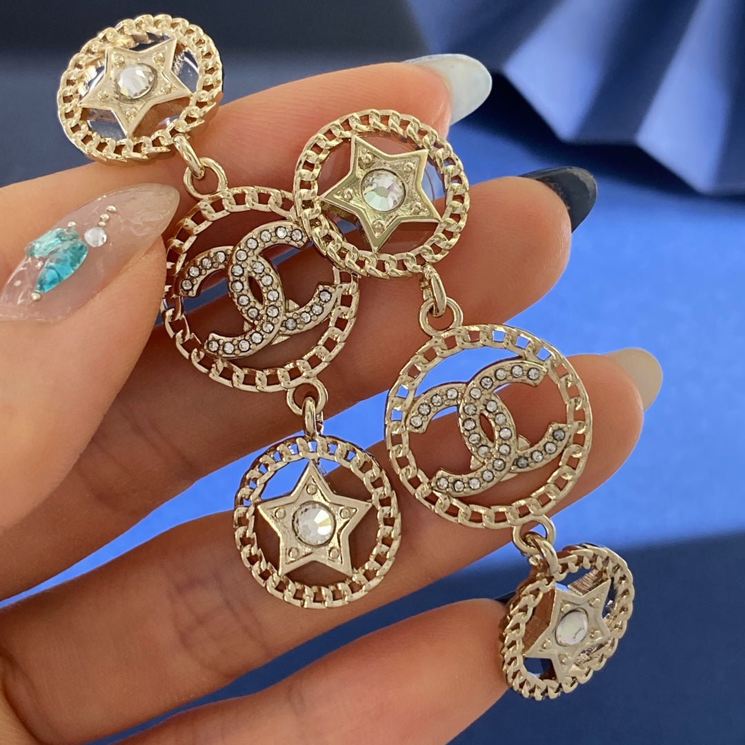 Martin Graham stud earrings in polished metal-tone – styled product view