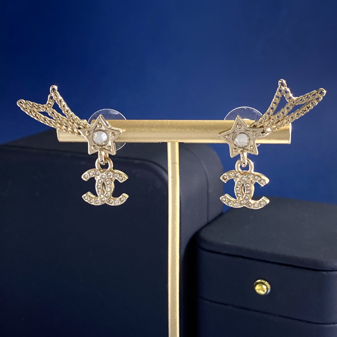 Martin Graham stud earrings in polished metal-tone – close-up detail