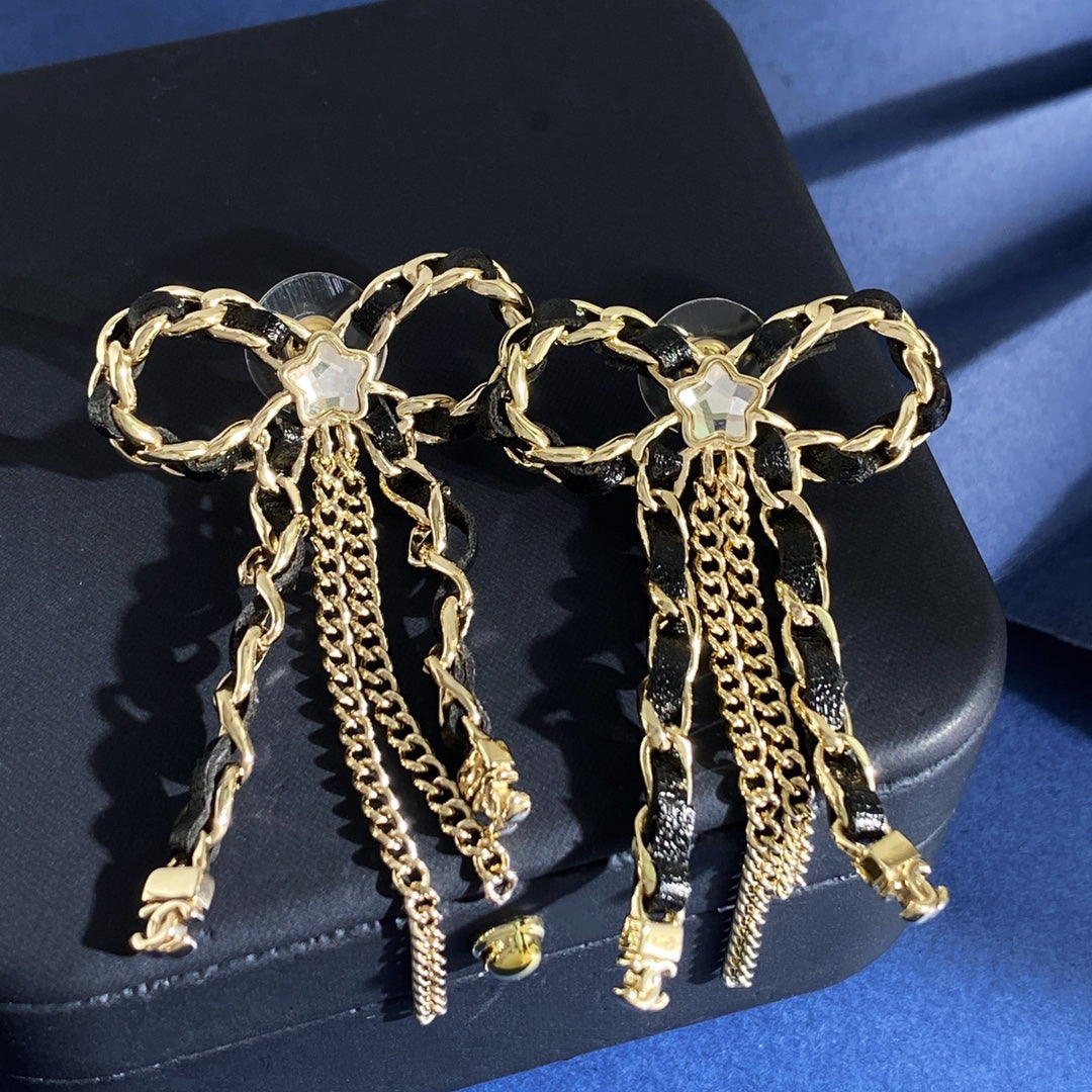 Martin Graham stud earrings in polished metal-tone – detail view