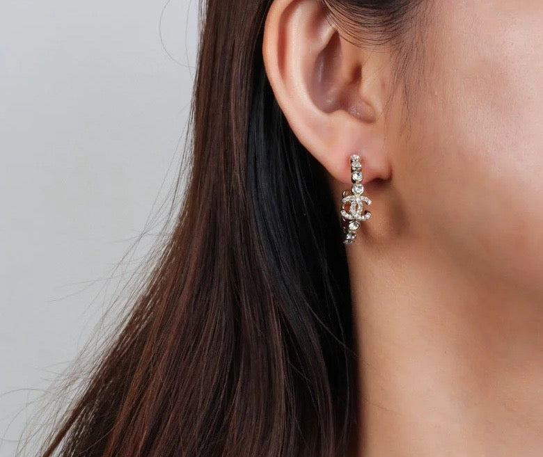 Martin Graham stud earrings in polished metal-tone – front product view