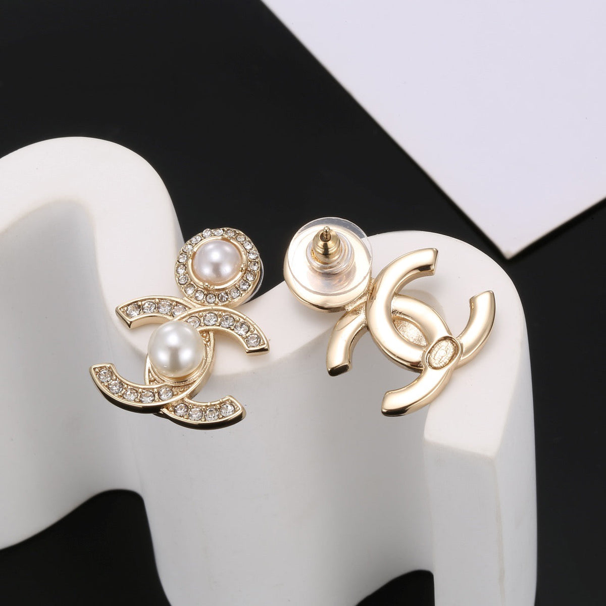 Martin Graham stud earrings in polished metal-tone – detail view