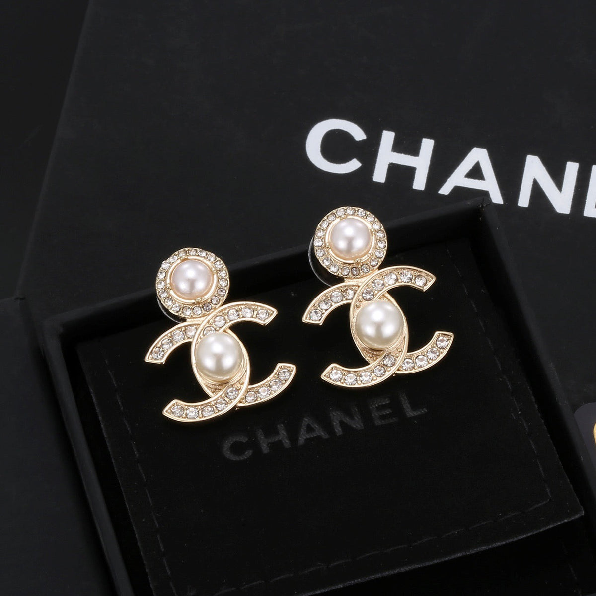 Martin Graham stud earrings in polished metal-tone – front product view