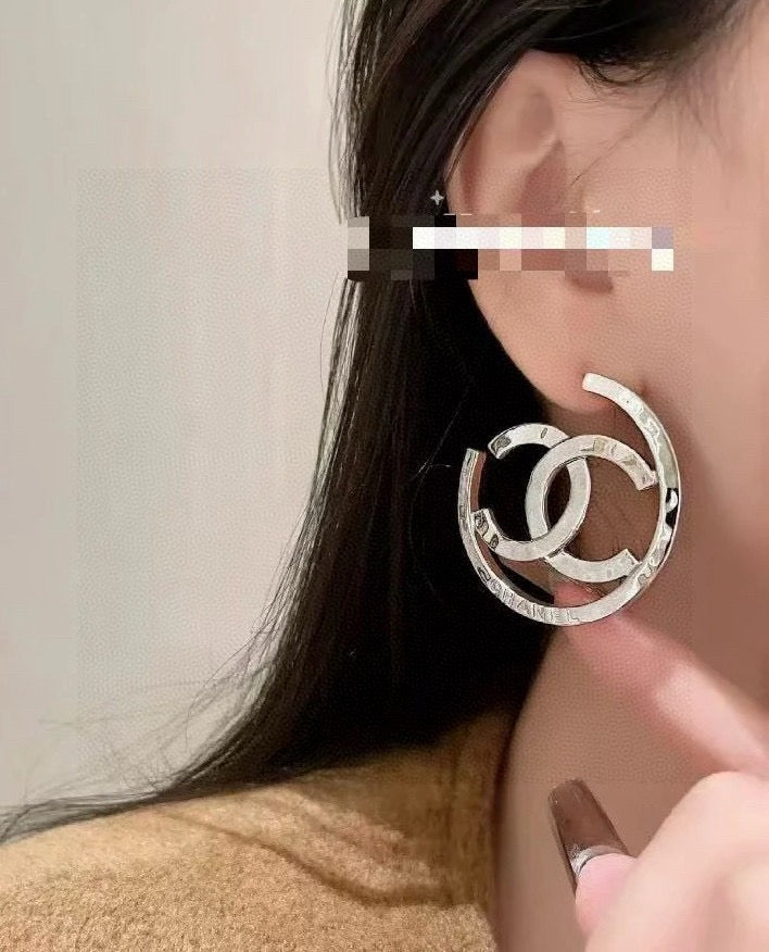 Martin Graham stud earrings in polished metal-tone – main product view