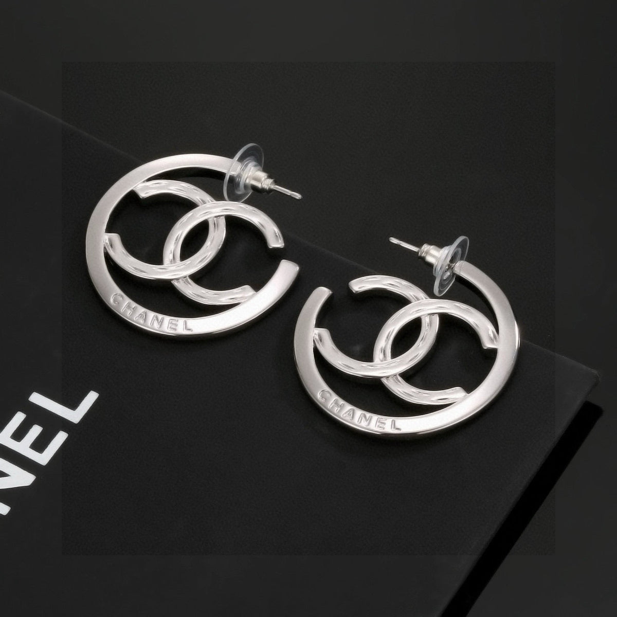 Martin Graham stud earrings in polished metal-tone – front product view