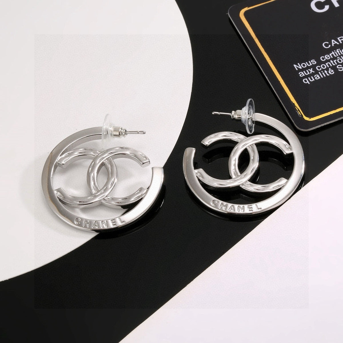 Martin Graham stud earrings in polished metal-tone – side detail