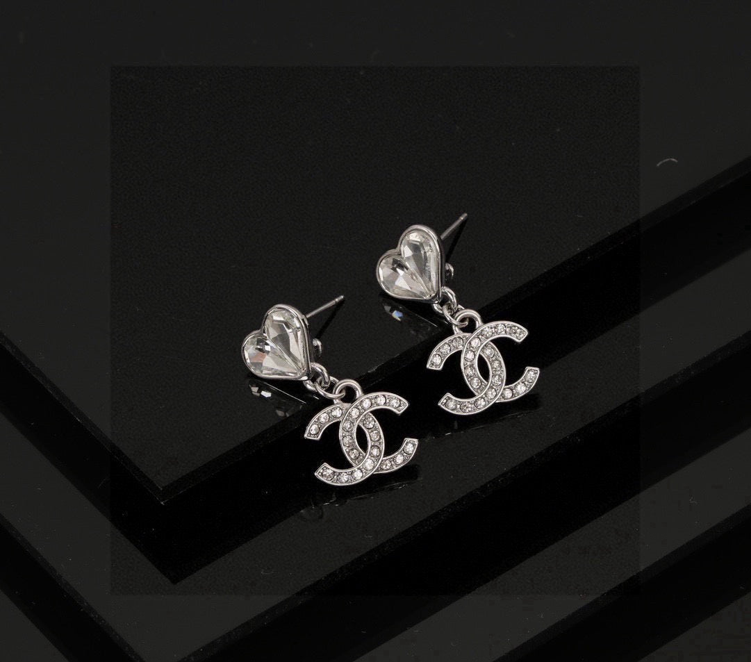 Martin Graham stud earrings in polished metal-tone – close-up detail