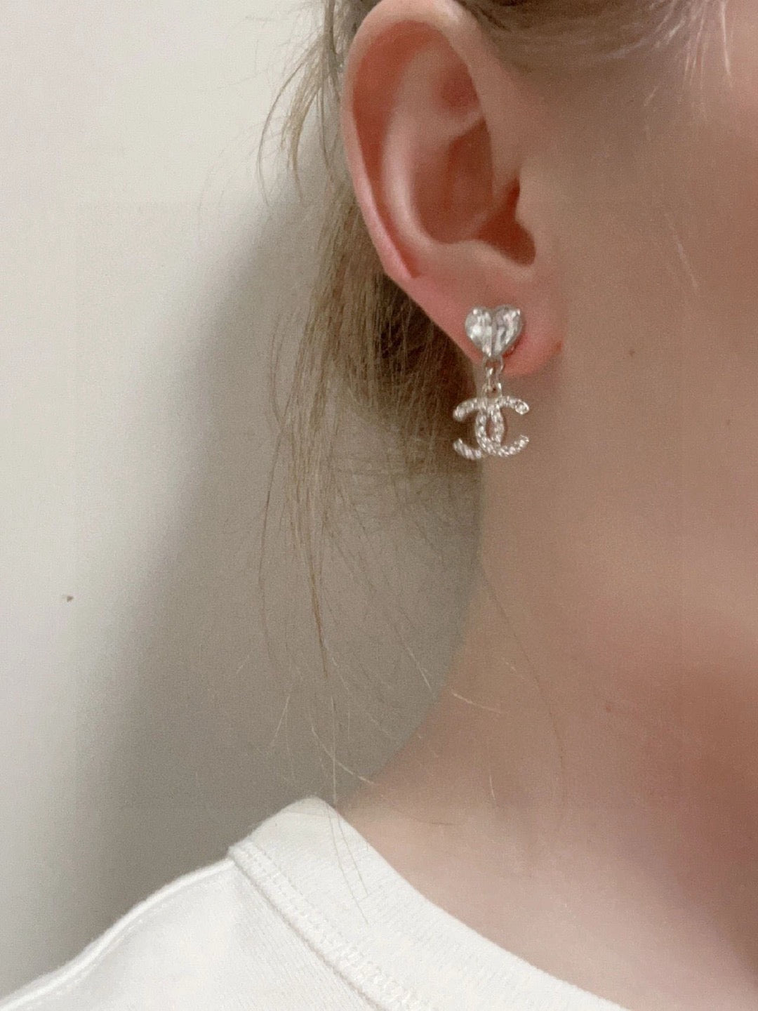 Martin Graham stud earrings in polished metal-tone – front product view