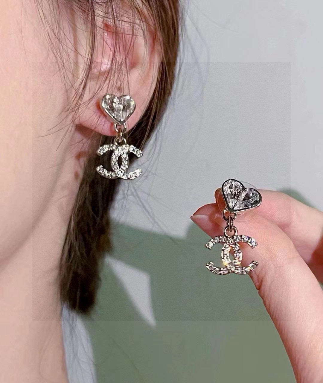 Martin Graham stud earrings in polished metal-tone – styled product view