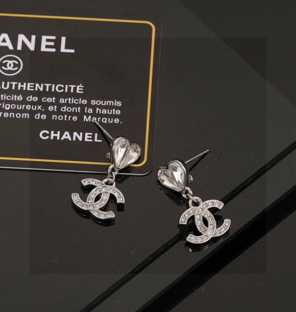 Martin Graham stud earrings in polished metal-tone – front product view