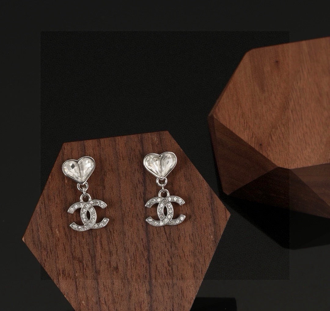 Martin Graham stud earrings in polished metal-tone – detail view