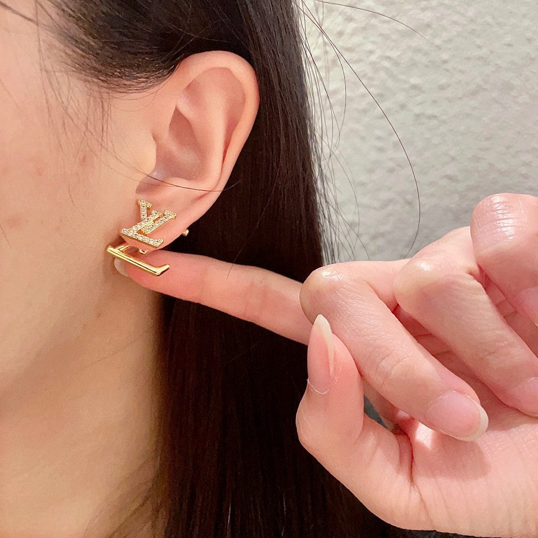 Martin Graham stud earrings in polished metal-tone – styled product view