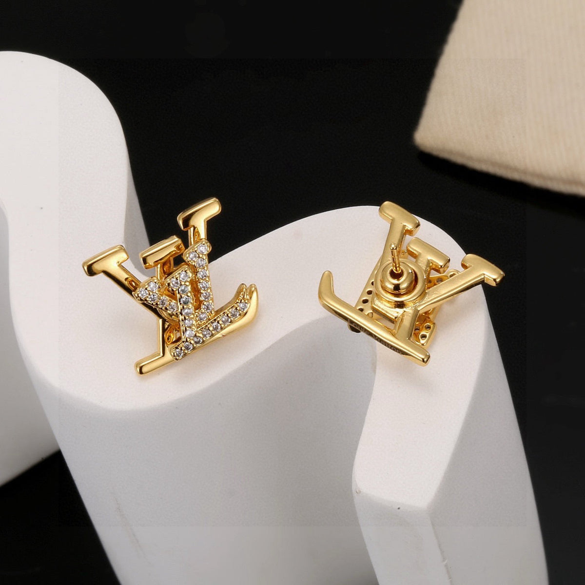 Martin Graham stud earrings in polished metal-tone – side detail