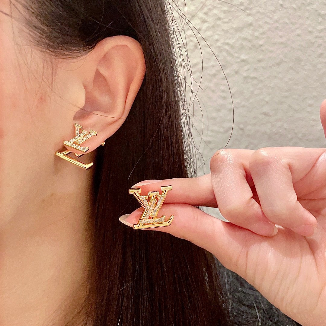 Martin Graham stud earrings in polished metal-tone – close-up detail