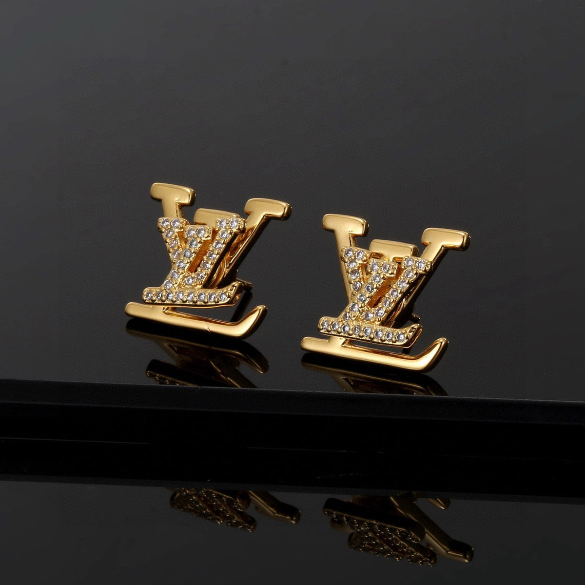 Martin Graham stud earrings in polished metal-tone – front product view