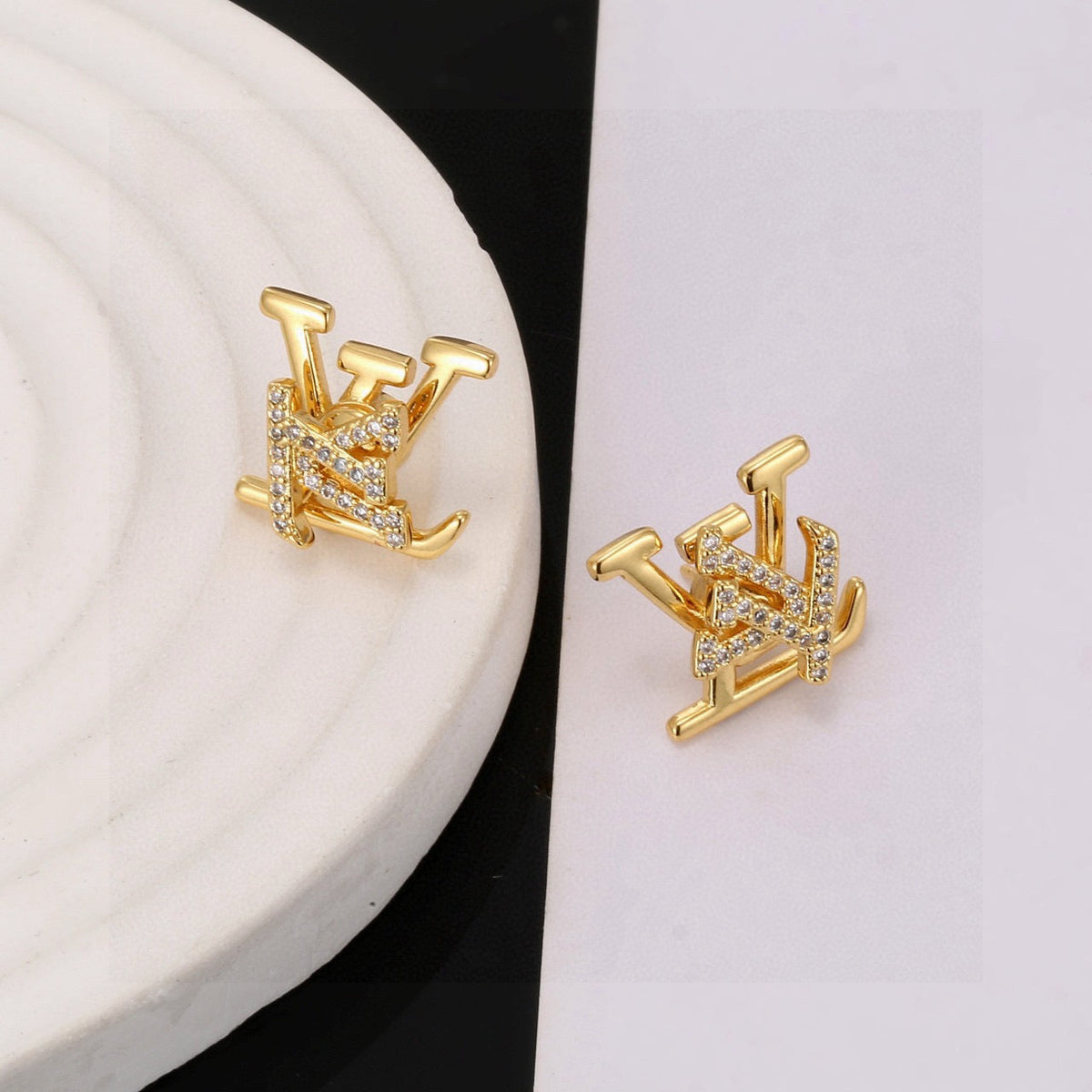 Martin Graham stud earrings in polished metal-tone – detail view