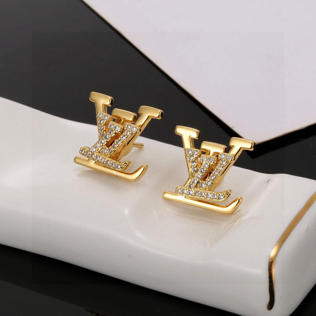 Martin Graham stud earrings in polished metal-tone – front product view