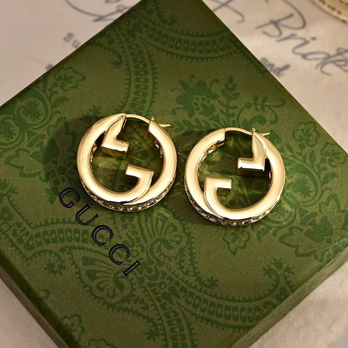 Martin Graham stud earrings in polished metal-tone – front product view