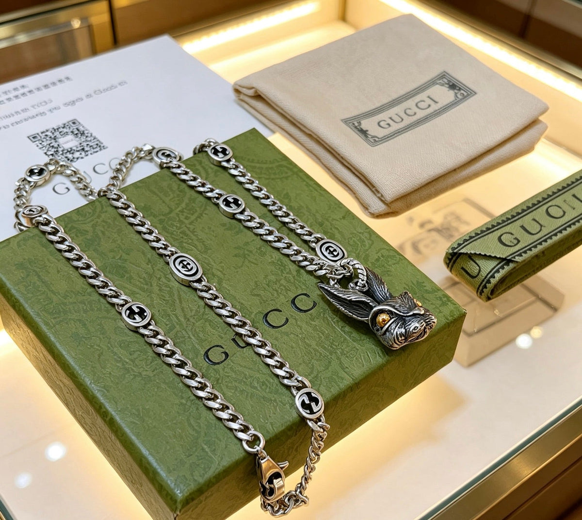 Martin Graham pendant necklace in polished metal-tone – close-up detail