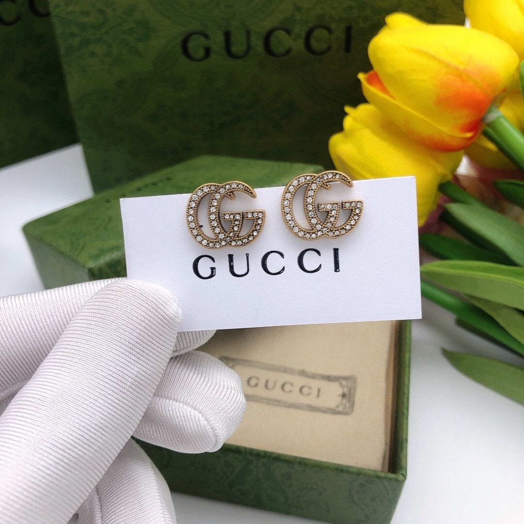 Martin Graham stud earrings in polished metal-tone – front product view