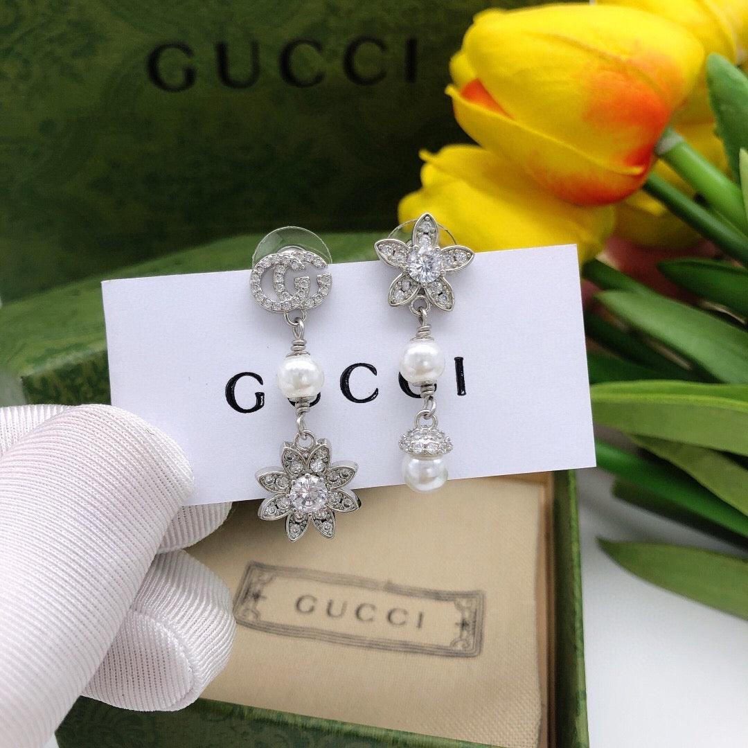Martin Graham stud earrings in polished metal-tone – front product view