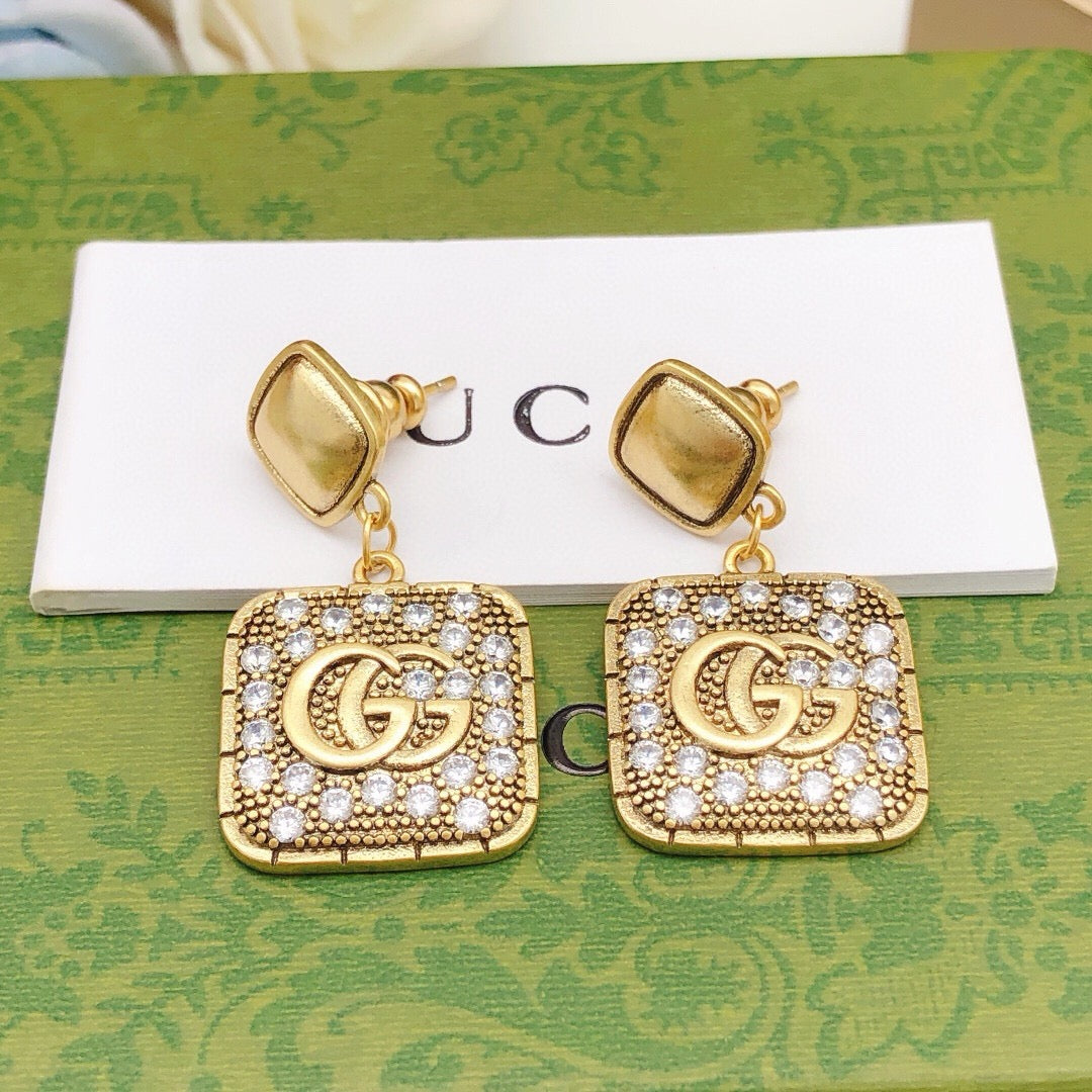 Martin Graham stud earrings in polished metal-tone – front product view