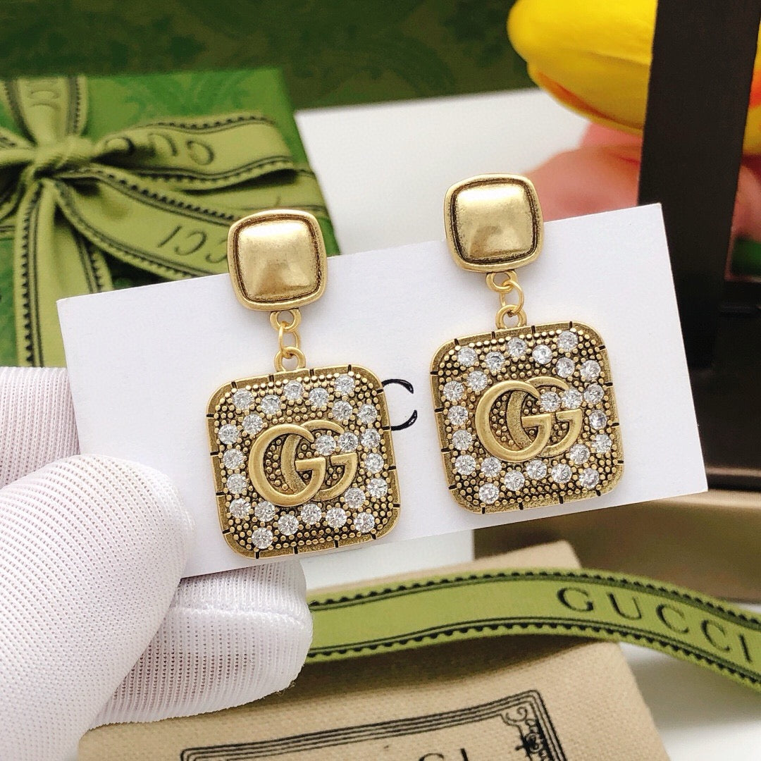 Martin Graham stud earrings in polished metal-tone – front product view
