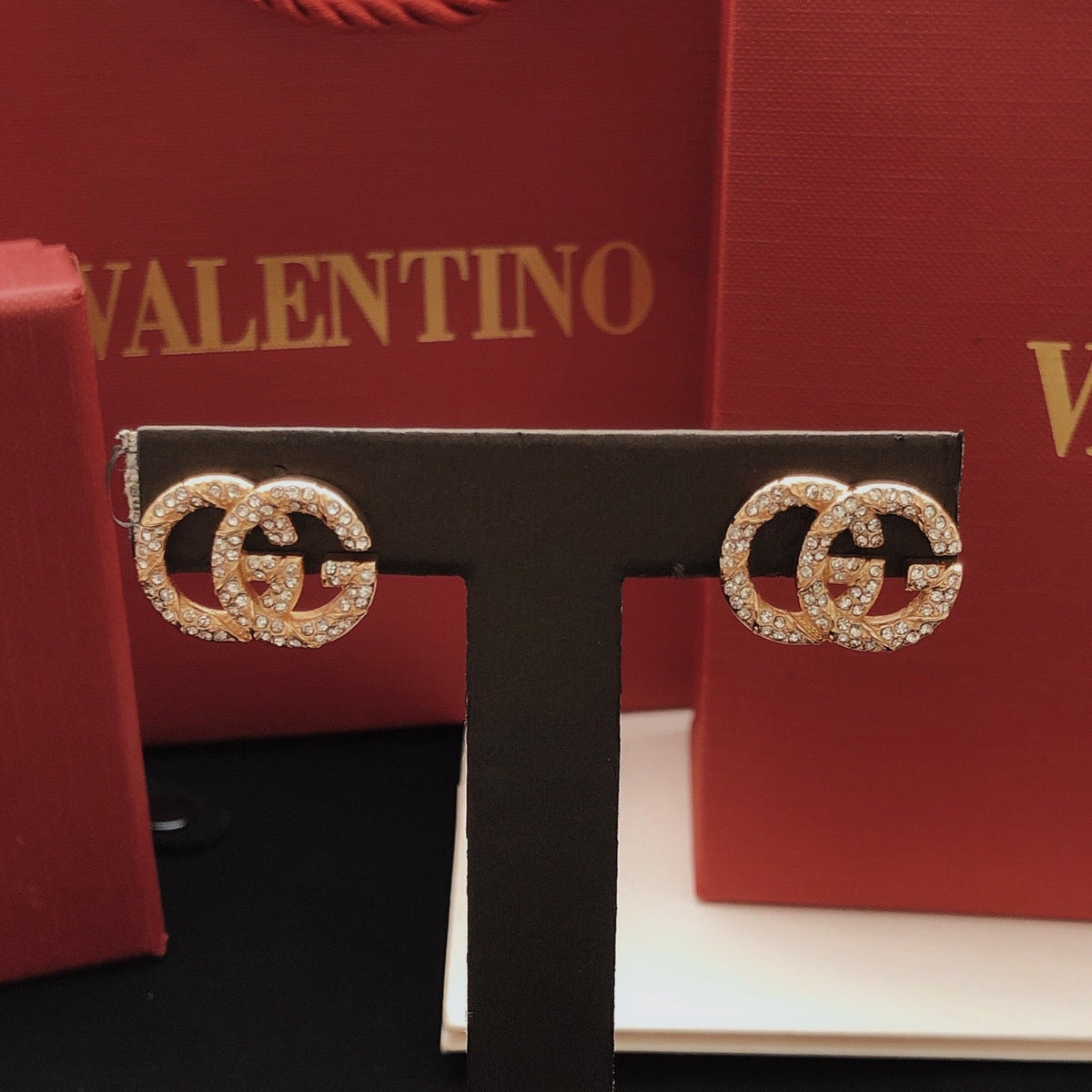 Martin Graham stud earrings in polished metal-tone – front product view