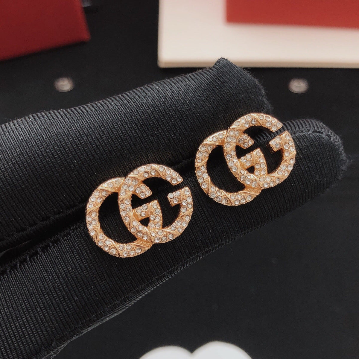 Martin Graham stud earrings in polished metal-tone – front product view