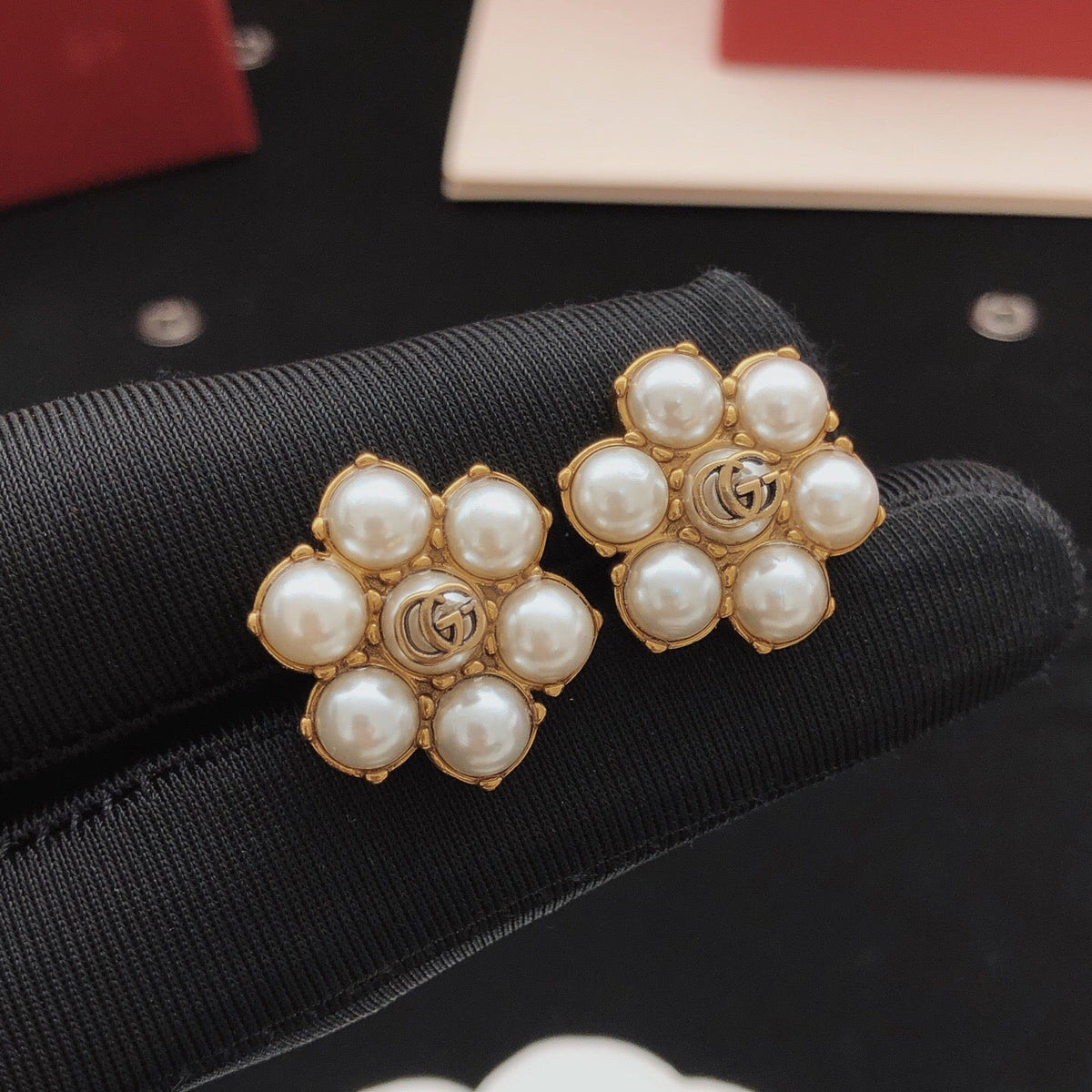 Martin Graham stud earrings in polished metal-tone – front product view