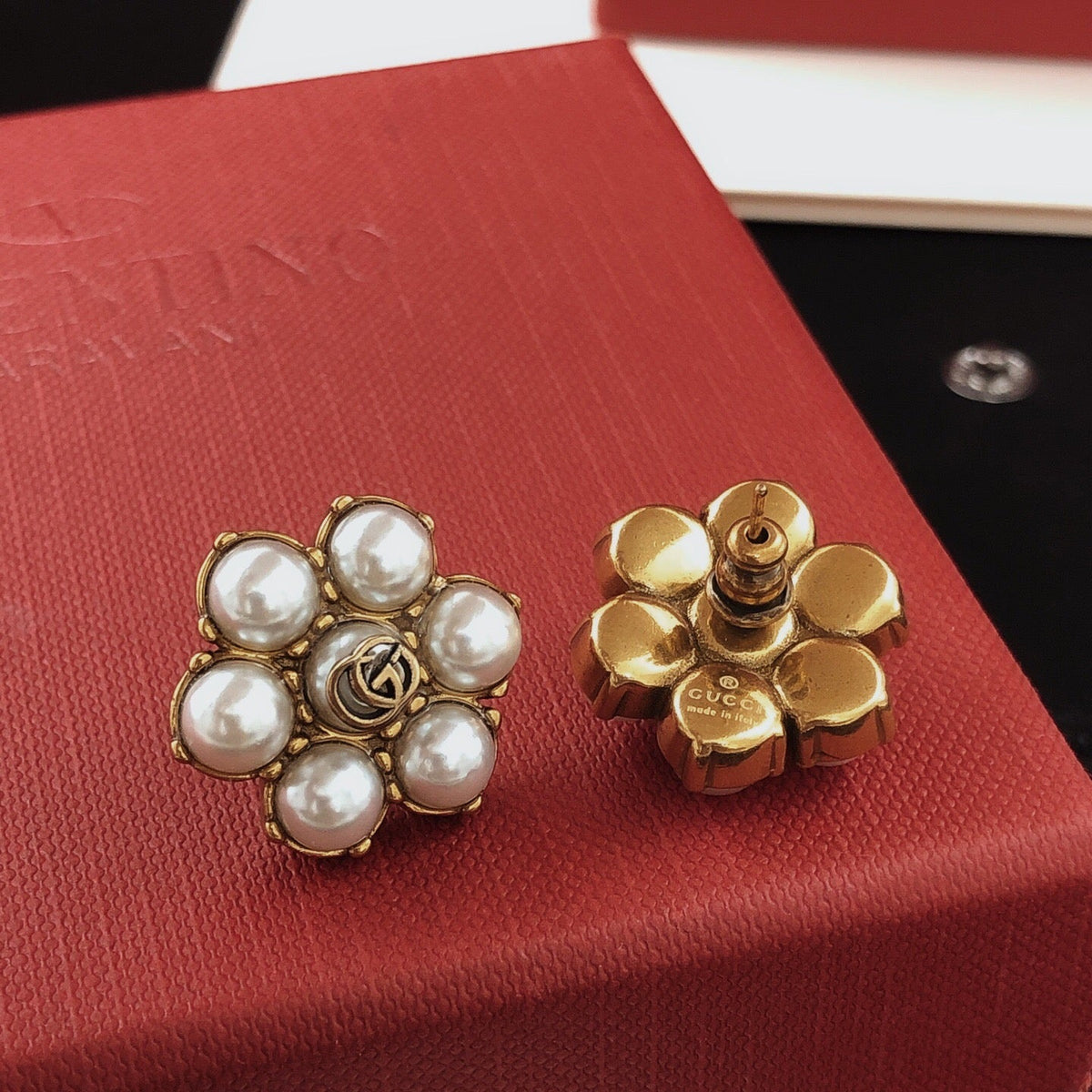 Martin Graham stud earrings in polished metal-tone – close-up detail