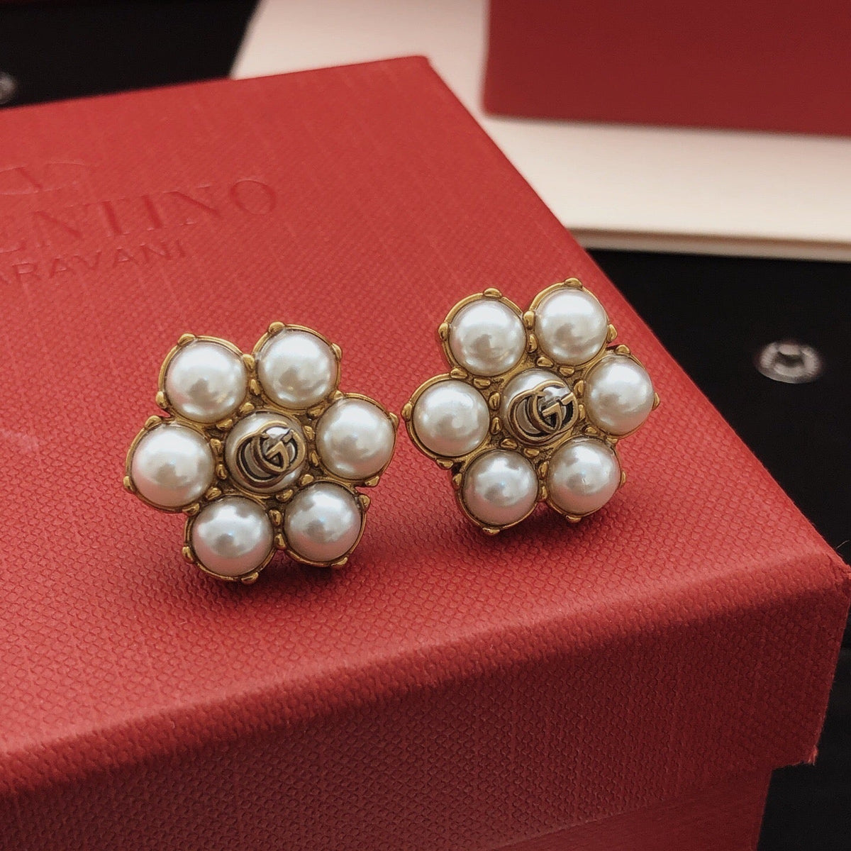 Martin Graham stud earrings in polished metal-tone – side detail