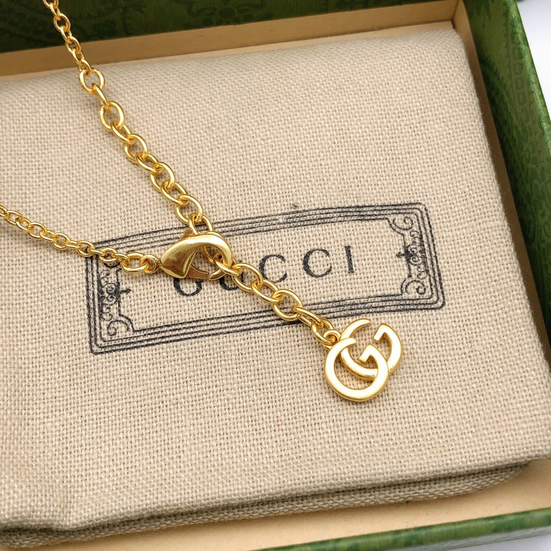 Martin Graham pendant necklace in polished metal-tone – close-up detail