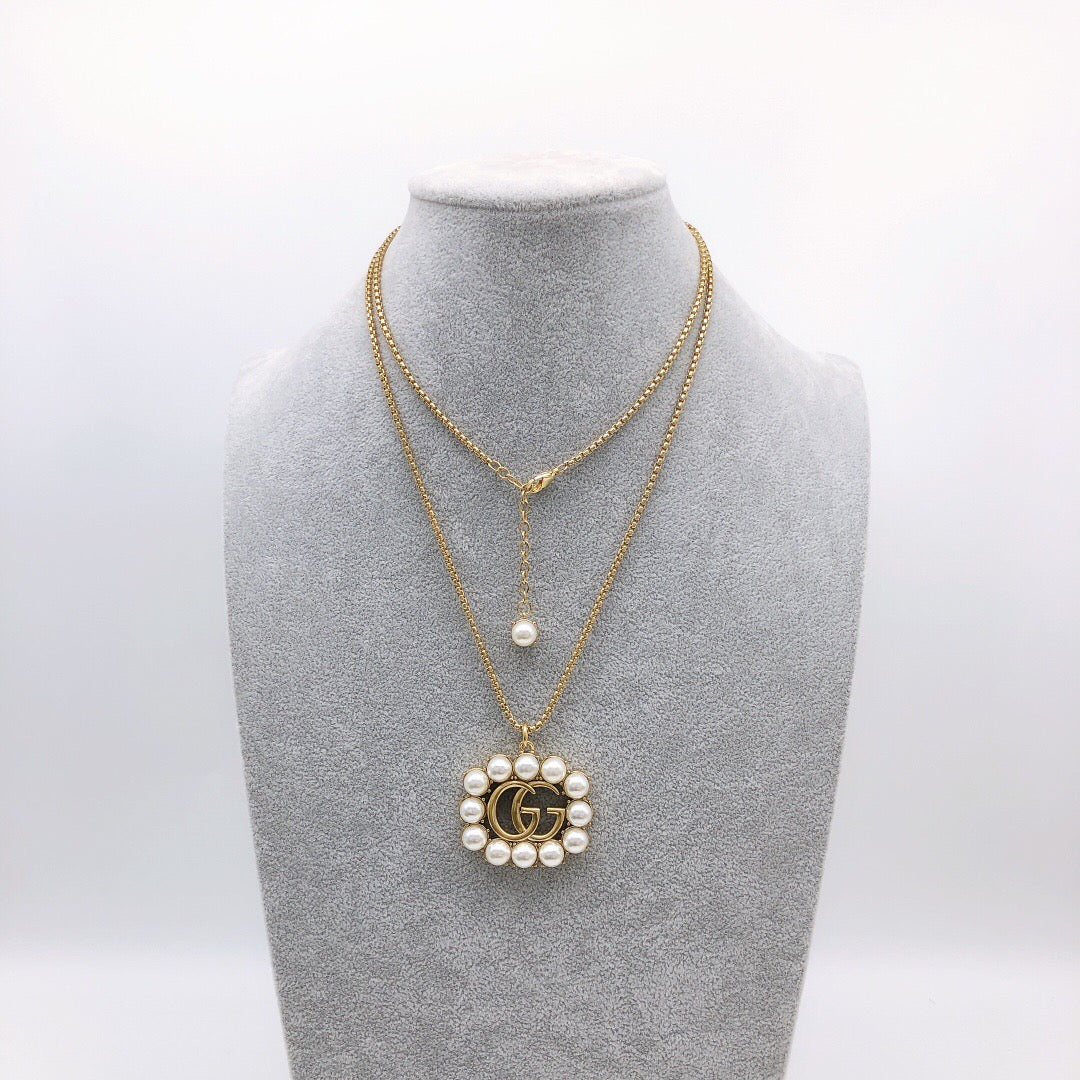 Martin Graham pendant necklace in polished metal-tone – front product view