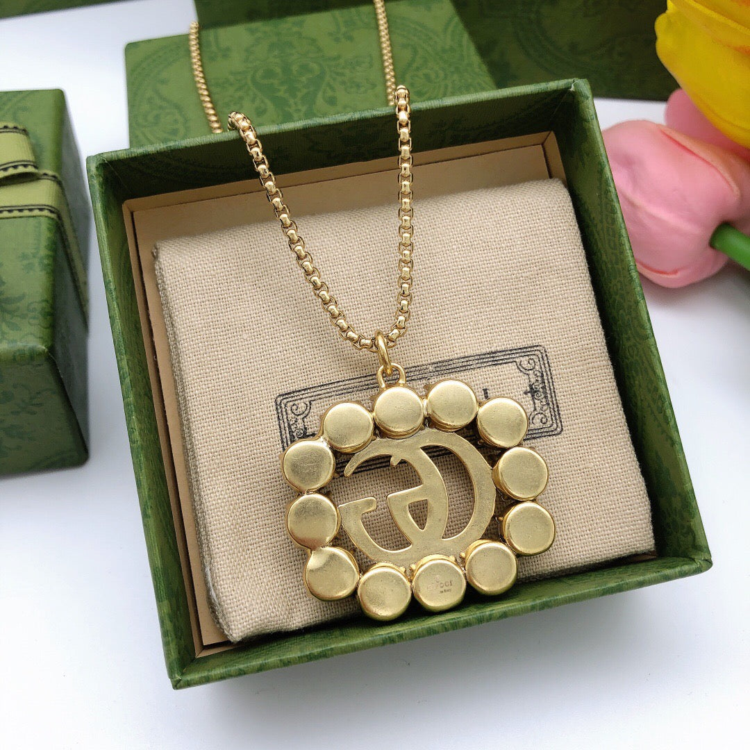 Martin Graham pendant necklace in polished metal-tone – styled product view