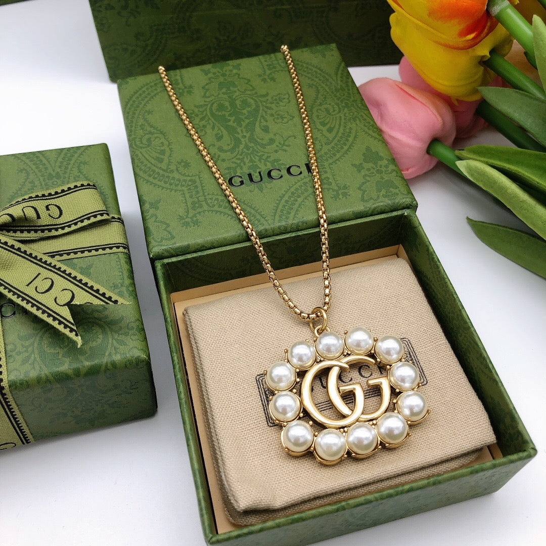 Martin Graham pendant necklace in polished metal-tone – detail view
