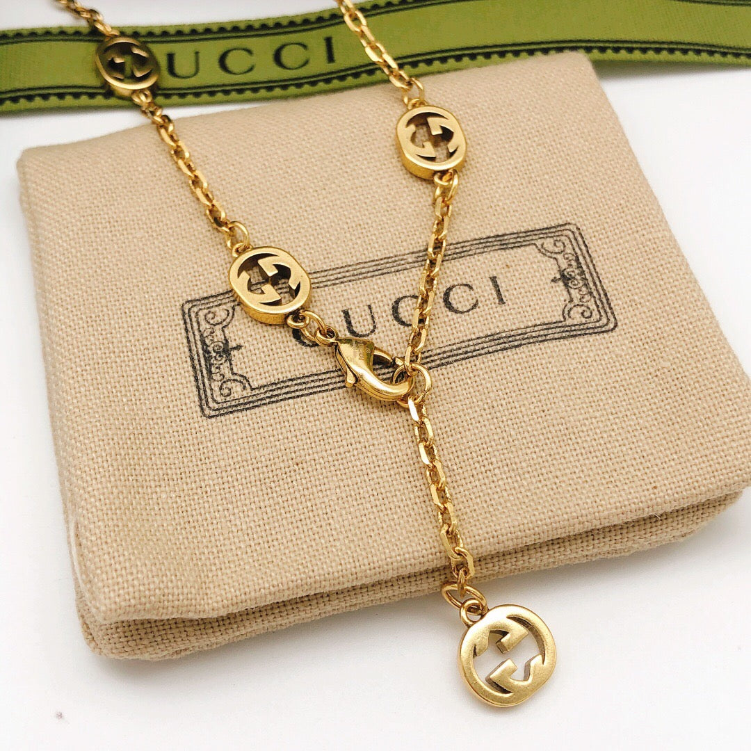 Martin Graham pendant necklace in polished metal-tone – detail view