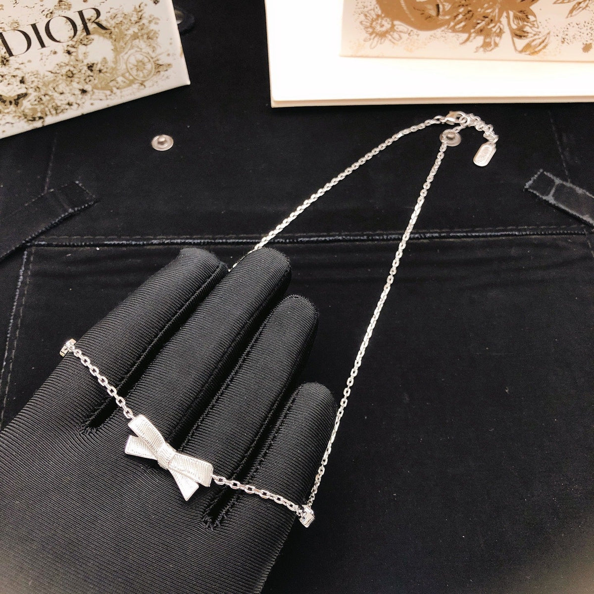 Martin Graham pendant necklace in polished metal-tone – close-up detail