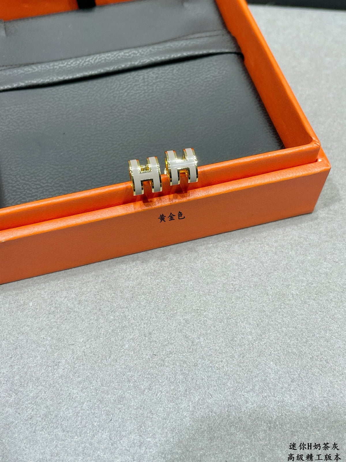 Martin Graham stud earrings in polished metal-tone – side detail