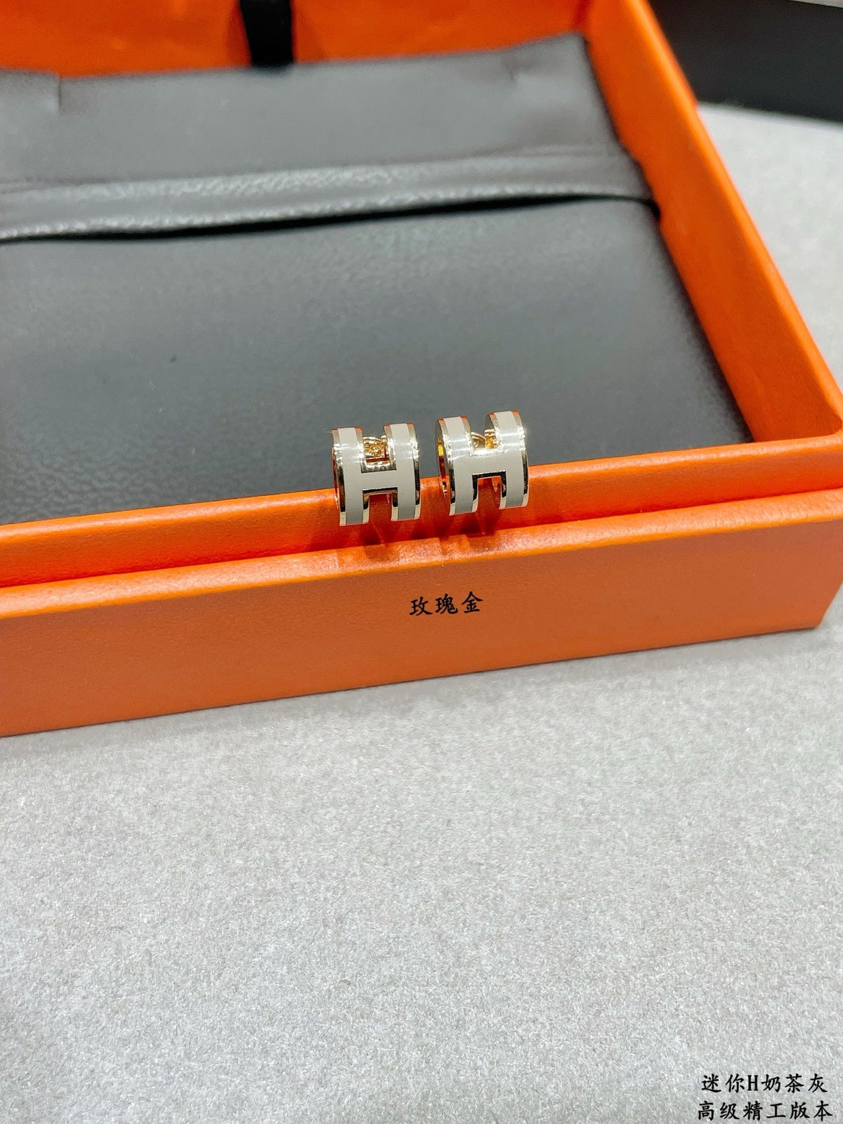 Martin Graham stud earrings in polished metal-tone – front product view