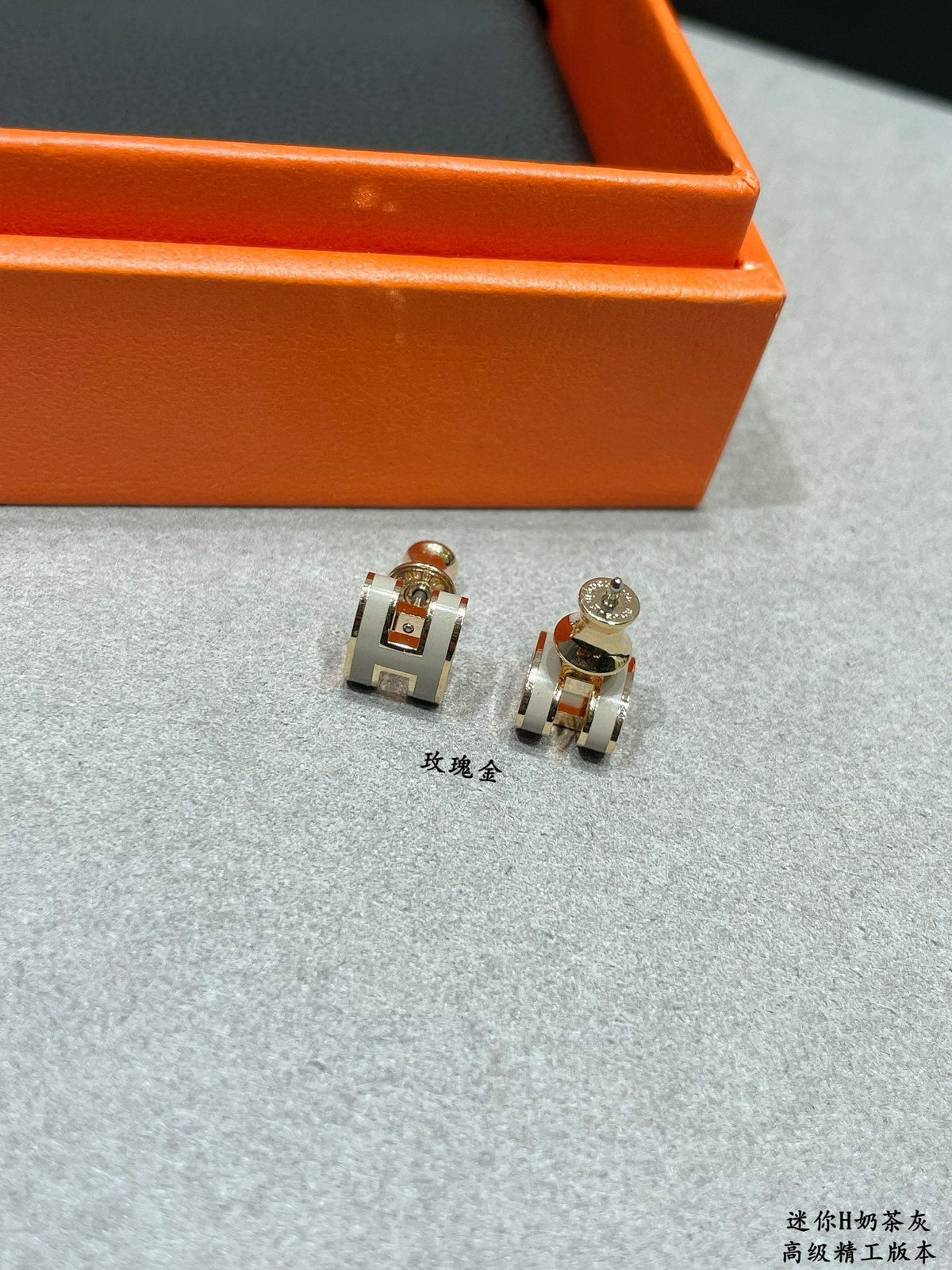 Martin Graham stud earrings in polished metal-tone – styled product view