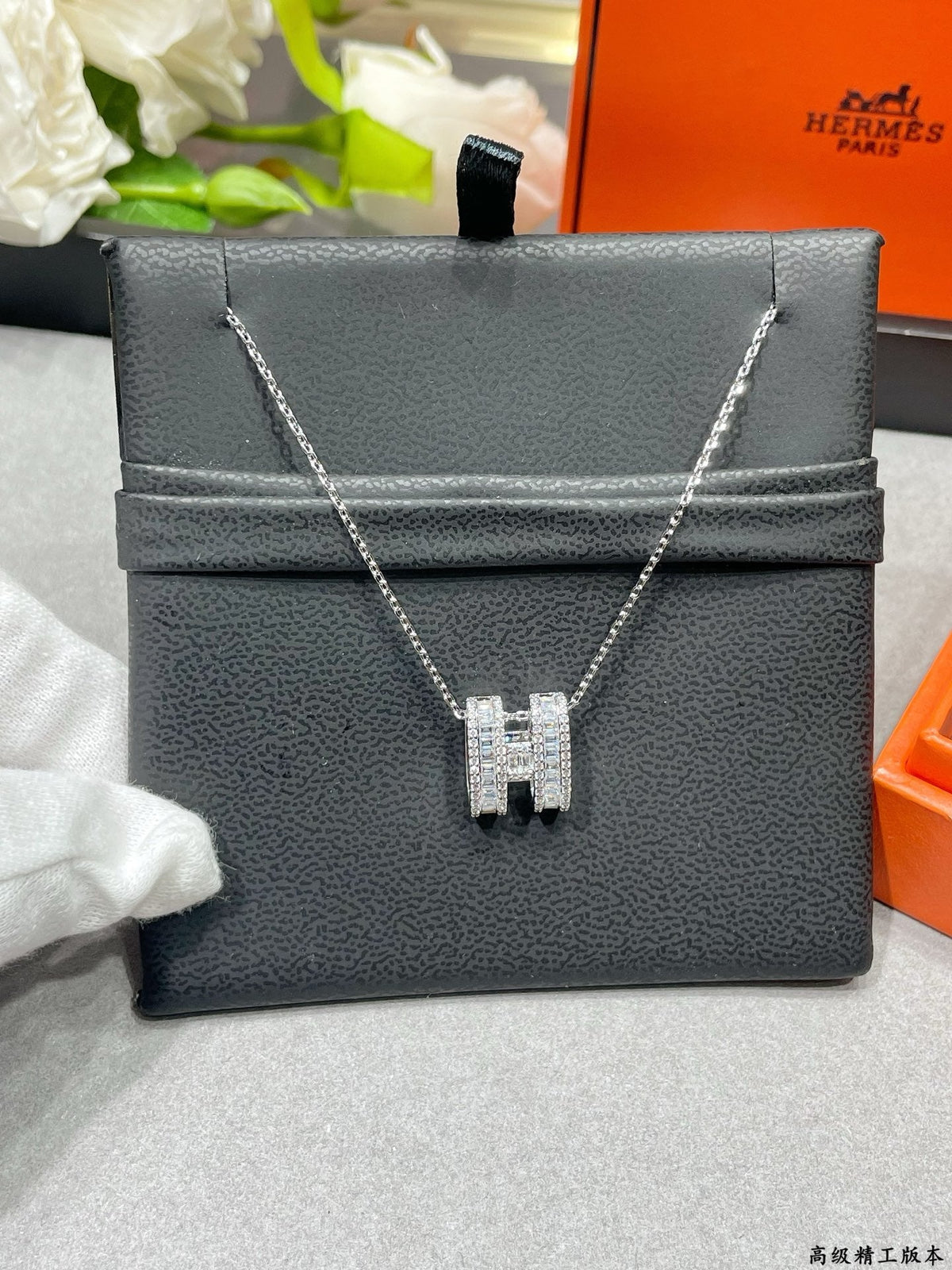 Martin Graham pendant necklace in polished metal-tone – side detail
