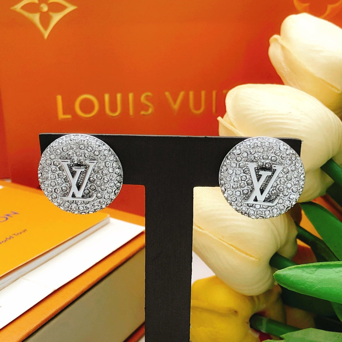Martin Graham stud earrings in polished metal-tone – styled product view