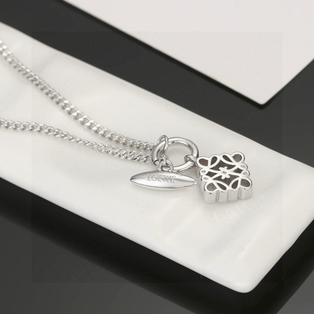 Martin Graham pendant necklace in polished metal-tone – side detail