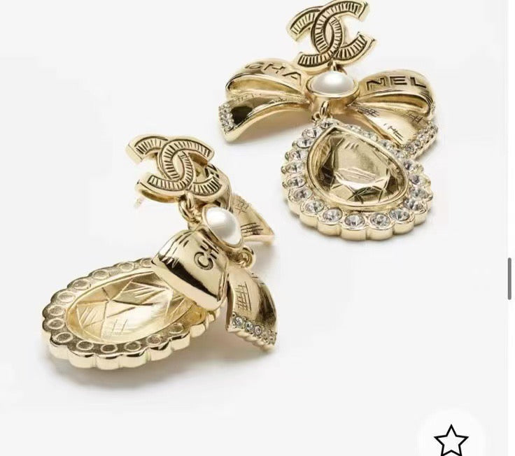 Martin Graham stud earrings in polished metal-tone – front product view