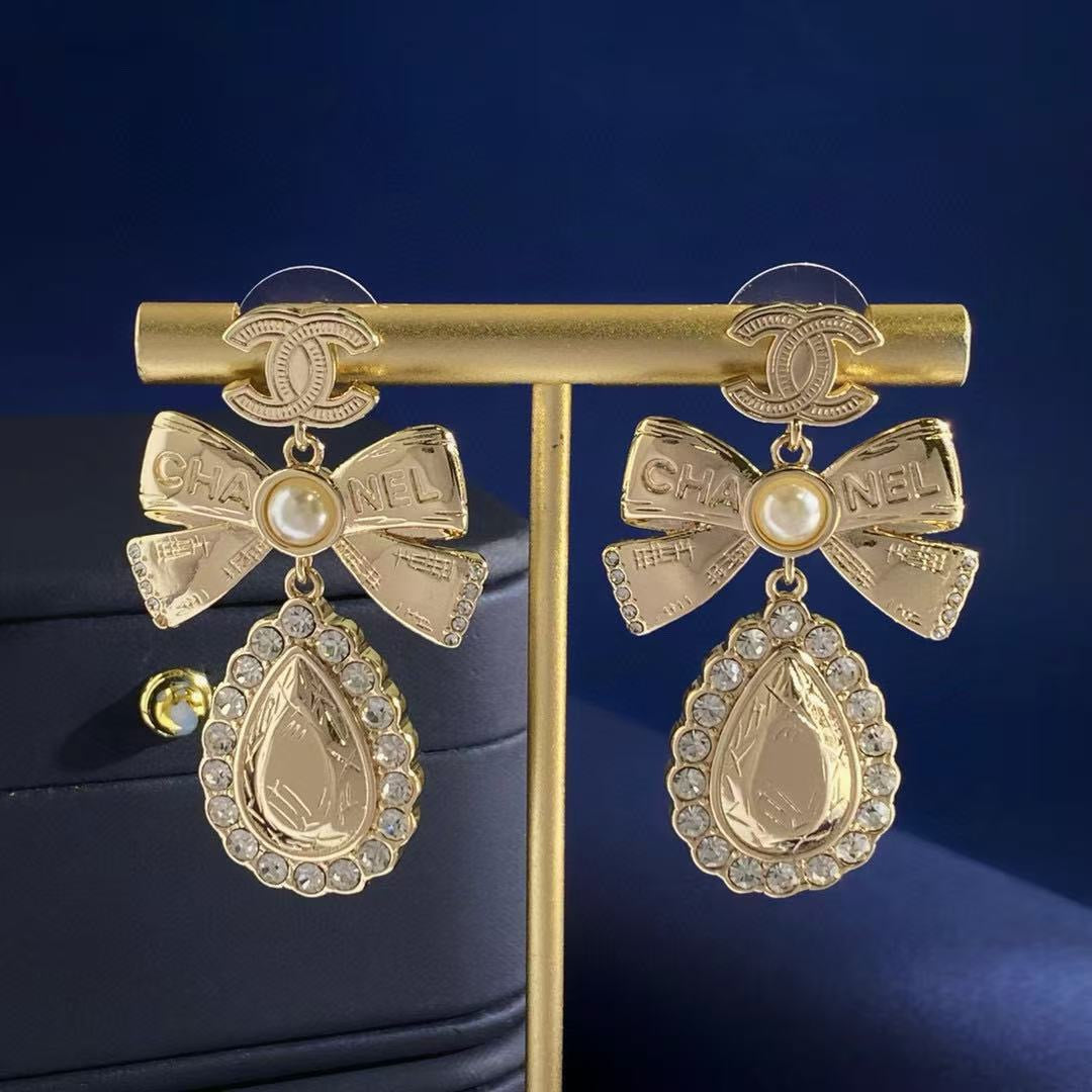 Martin Graham stud earrings in polished metal-tone – detail view